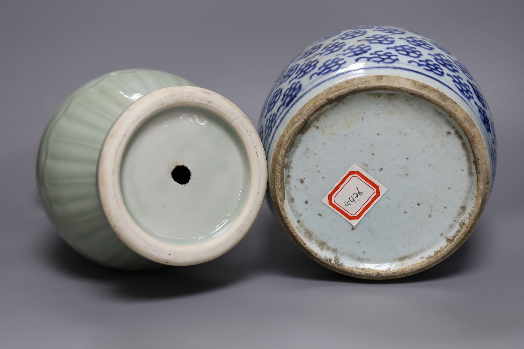 A Chinese celadon ground vase and a similar blue and white jar, tallest 30cm